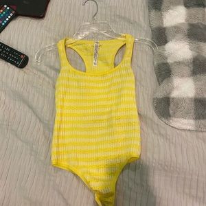 yellow body suit